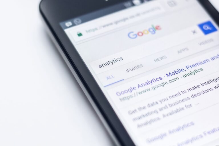 Close-up of phone screen displaying analytics search results