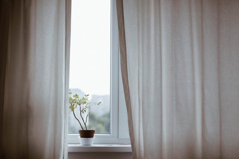Quiet minimalist window scene reflecting 8 things I don't buy anymore