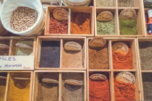 Organized spice bins representing the Surfer SEO affiliate program structure